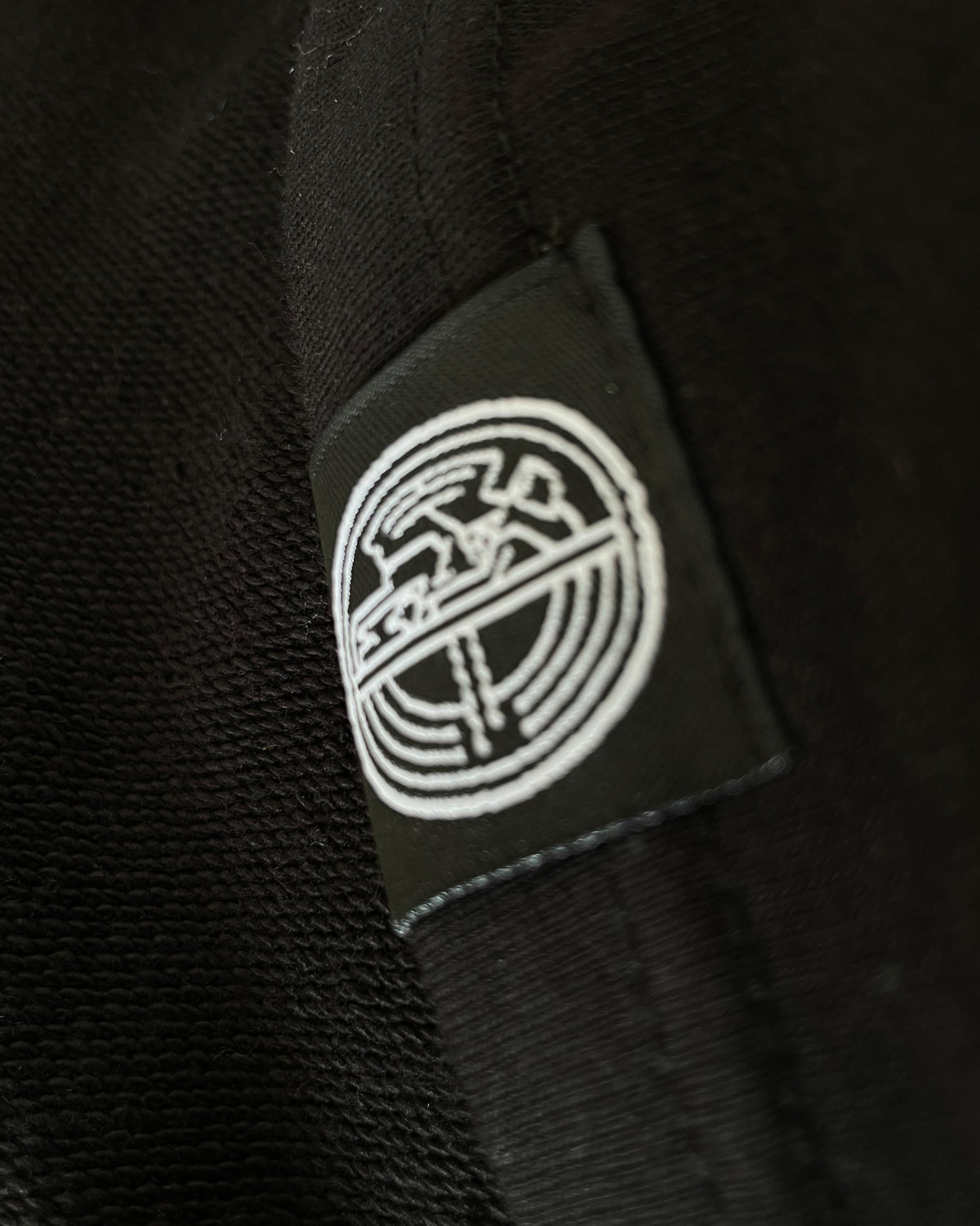 BLACK RAGLAN ROUND SHIRT
